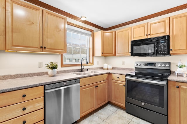 kitchen with appliances with stainless steel finishes, a sink, light countertops, light brown cabinets, and light tile patterned flooring