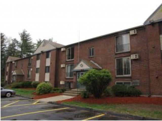 131 English Village Rd Unit 204, Manchester, NH 03102 - view of property featuring uncovered parking