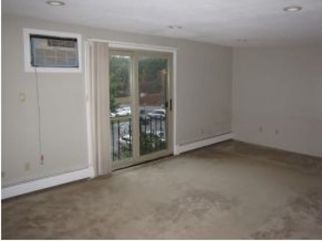 131 English Village Rd Unit 204, Manchester, NH 03102 - unfurnished room with a baseboard heating unit and a wall mounted air conditioner