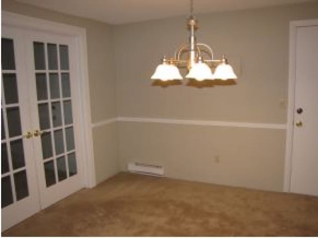 131 English Village Rd Unit 204, Manchester, NH 03102 - unfurnished dining area with an inviting chandelier, a baseboard radiator, and french doors