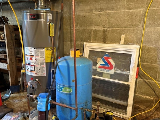 utility room featuring gas water heater