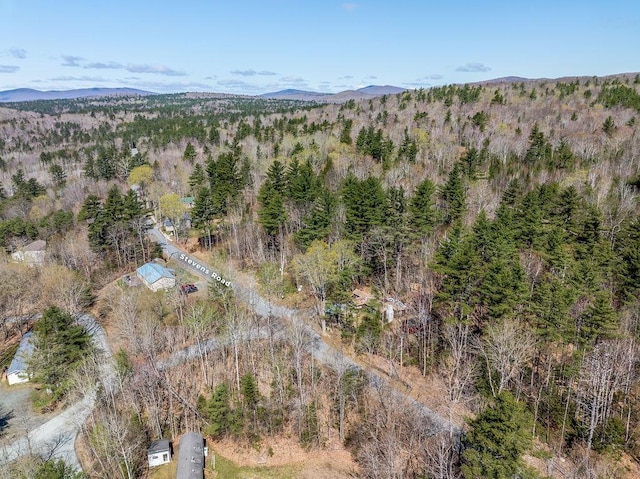 aerial view with a mountain view and a forest view