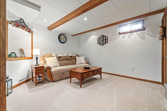 carpeted living area featuring recessed lighting, baseboards, visible vents, and a paneled ceiling