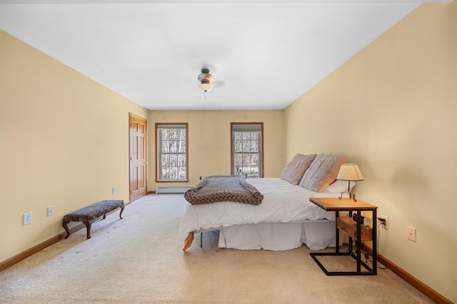 bedroom with carpet flooring, baseboards, and a baseboard radiator