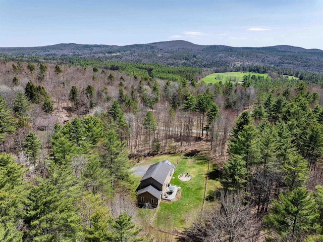 aerial view with a mountain view and a forest view