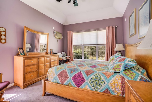 bedroom with light colored carpet, vaulted ceiling, and multiple windows