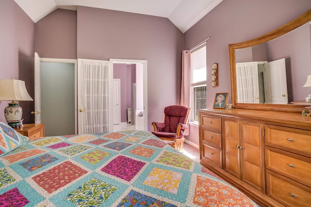 bedroom with vaulted ceiling and ensuite bath