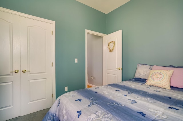 carpeted bedroom with a closet