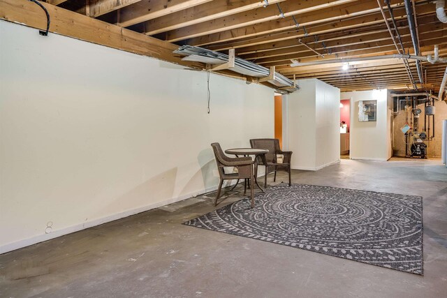 unfinished below grade area featuring baseboards