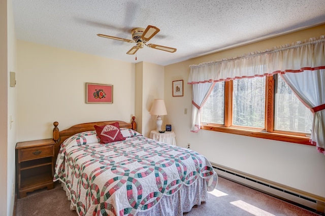 carpeted bedroom featuring a baseboard radiator, a ceiling fan, and a textured ceiling
