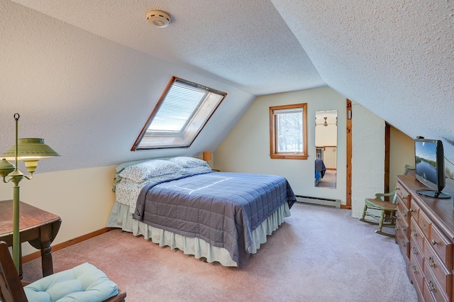 carpeted bedroom featuring baseboards, a textured ceiling, a baseboard heating unit, and vaulted ceiling with skylight