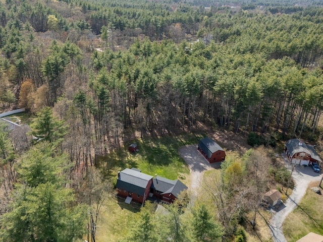 birds eye view of property featuring a wooded view