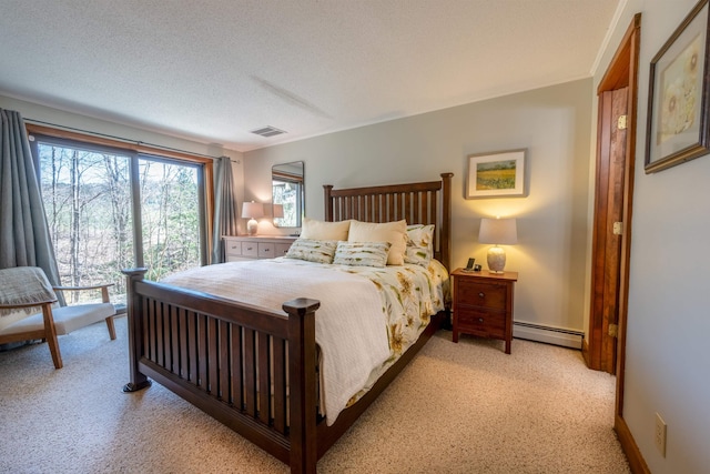 bedroom with light colored carpet, a textured ceiling, visible vents, and a baseboard radiator