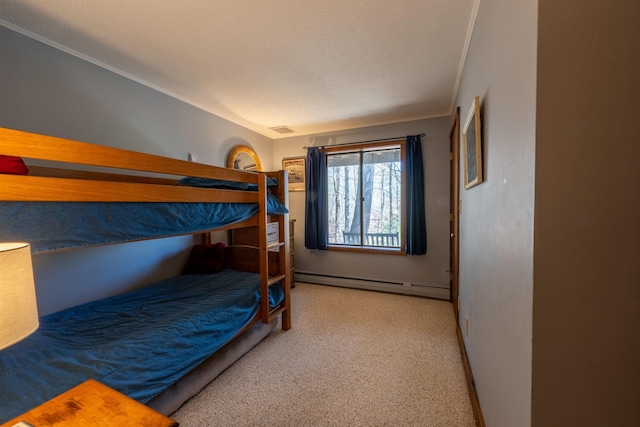 bedroom with carpet floors, crown molding, visible vents, baseboards, and baseboard heating
