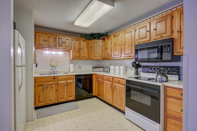 4D Seasons At Attitash Rd Unit D, Bartlett, NH 03812 - kitchen with black appliances, a sink, light countertops, light flooring, and a textured ceiling