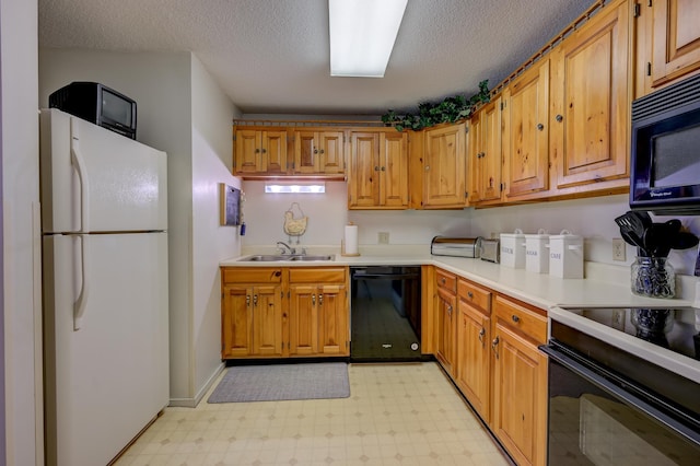 4D Seasons At Attitash Rd Unit D, Bartlett, NH 03812 - kitchen featuring black appliances, a sink, light floors, light countertops, and a textured ceiling