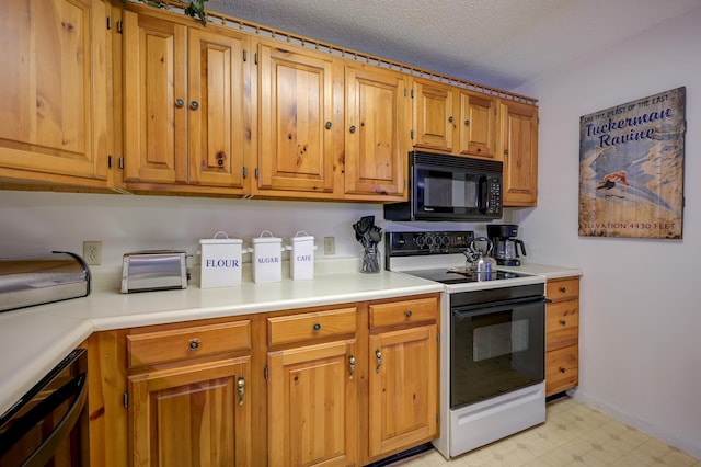 4D Seasons At Attitash Rd Unit D, Bartlett, NH 03812 - kitchen featuring black microwave, electric range oven, beverage cooler, light floors, and light countertops