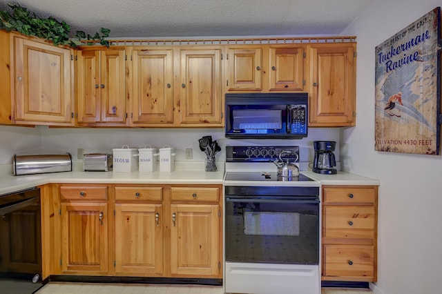 4D Seasons At Attitash Rd Unit D, Bartlett, NH 03812 - kitchen with black microwave, range with electric cooktop, light countertops, and dishwashing machine