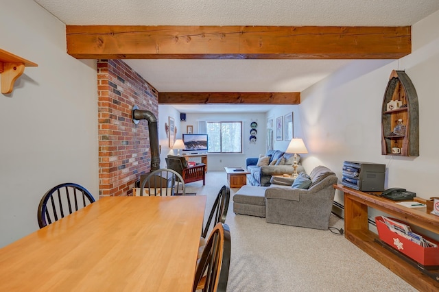 4D Seasons At Attitash Rd Unit D, Bartlett, NH 03812 - dining space featuring a wood stove, beamed ceiling, carpet floors, and a baseboard heating unit