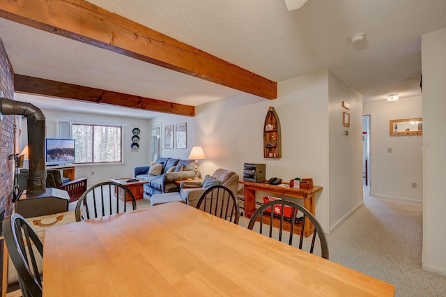 4D Seasons At Attitash Rd Unit D, Bartlett, NH 03812 - dining space with carpet floors, baseboards, beamed ceiling, and a textured ceiling