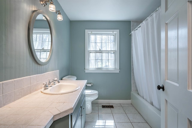 bathroom featuring tile patterned flooring, visible vents, vanity, toilet, and baseboards