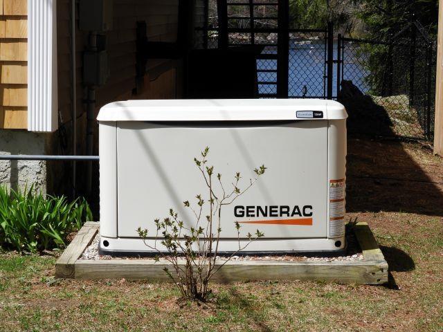 details featuring fence and a power unit