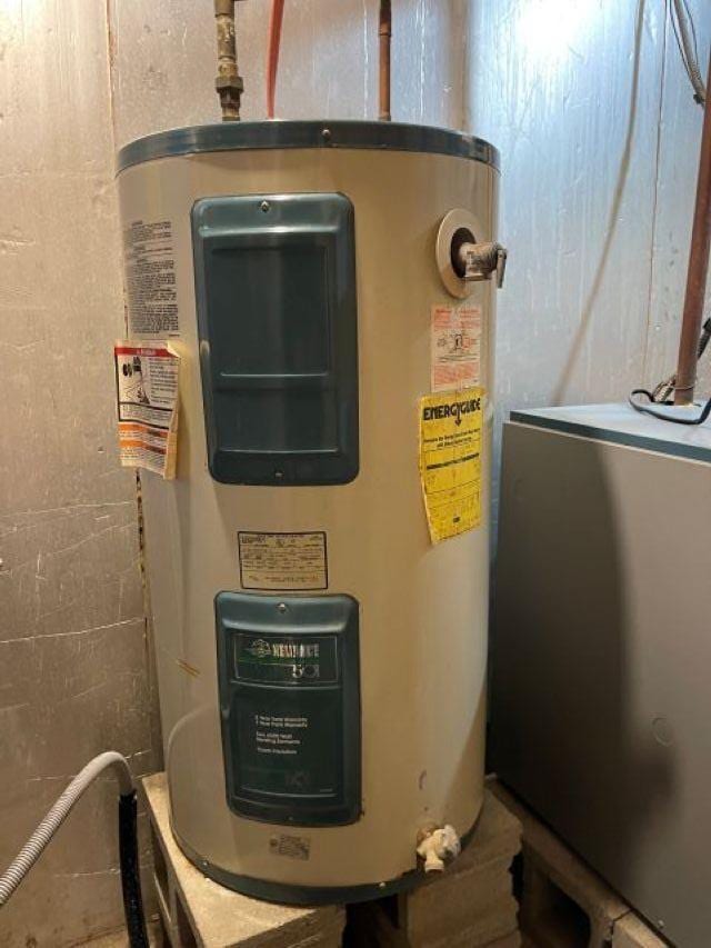 utility room with water heater