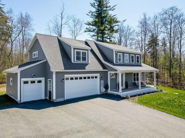view of front of home featuring a porch, an attached garage, roof with shingles, and driveway