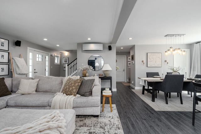 living area featuring stairs, recessed lighting, baseboards, and wood finished floors