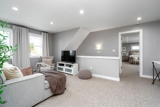 carpeted living room featuring a healthy amount of sunlight, baseboards, and recessed lighting
