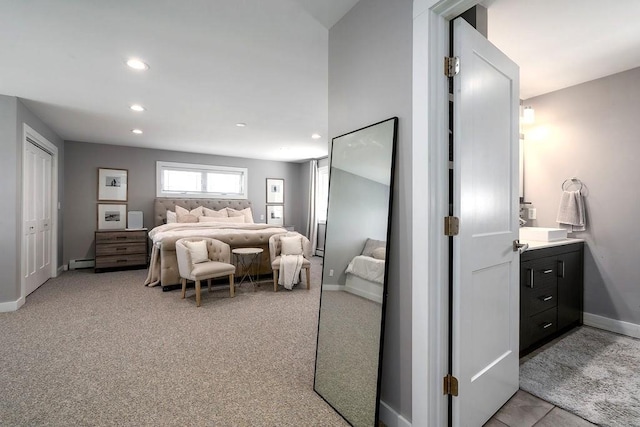 bedroom featuring recessed lighting, baseboards, a baseboard heating unit, and light carpet