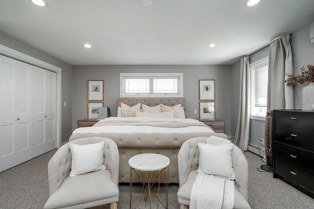 bedroom with recessed lighting, carpet, and a closet