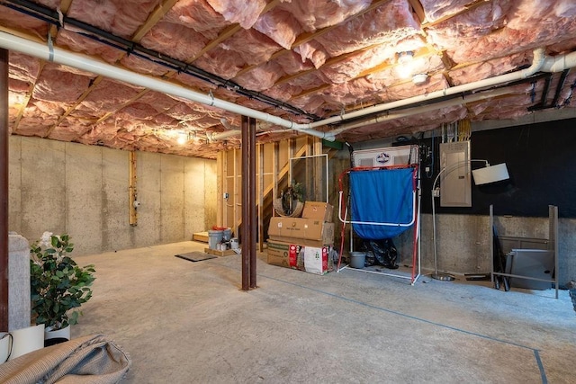 unfinished below grade area with electric panel