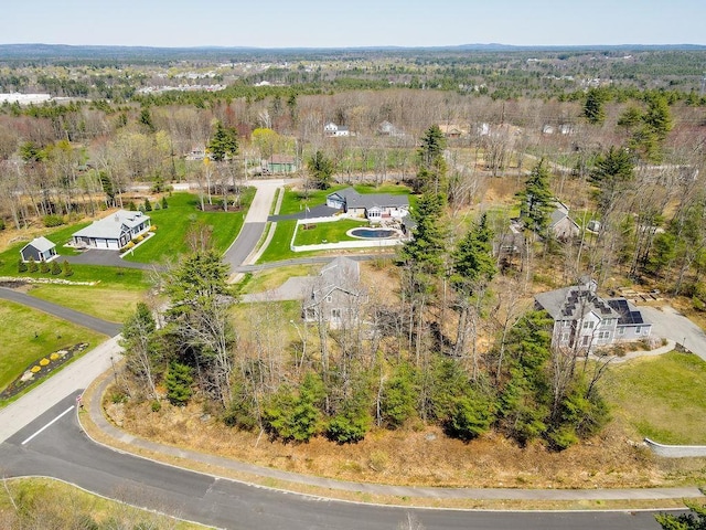 aerial view with a wooded view