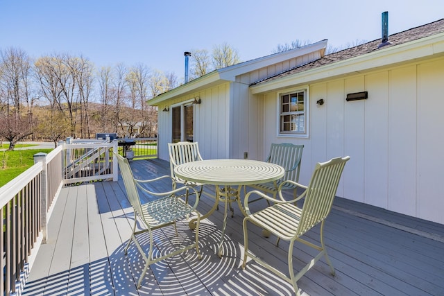 deck featuring outdoor dining area