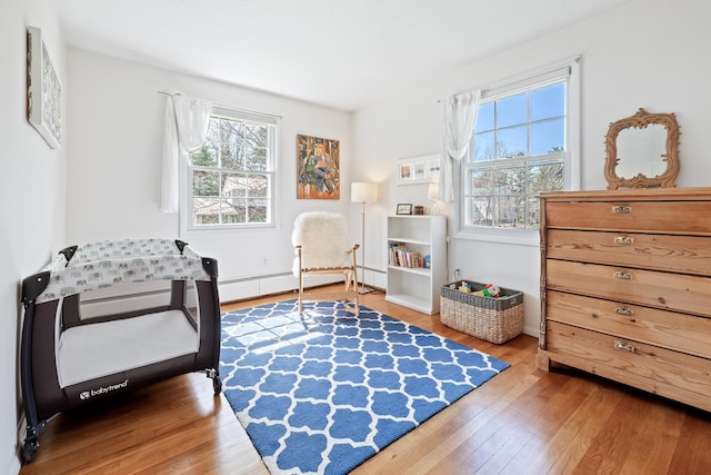 sitting room featuring baseboards and wood finished floors