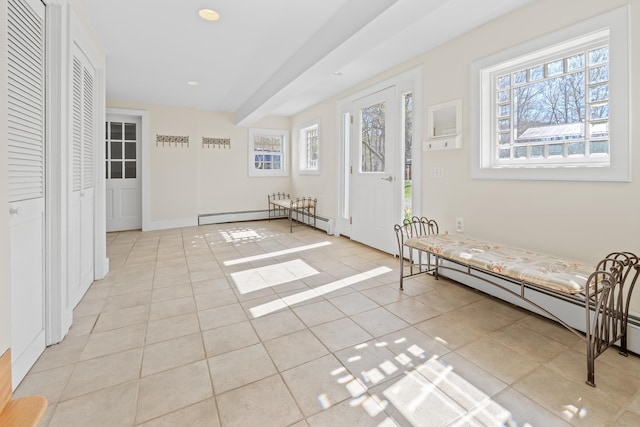 foyer entrance featuring recessed lighting, a baseboard heating unit, and light tile patterned floors