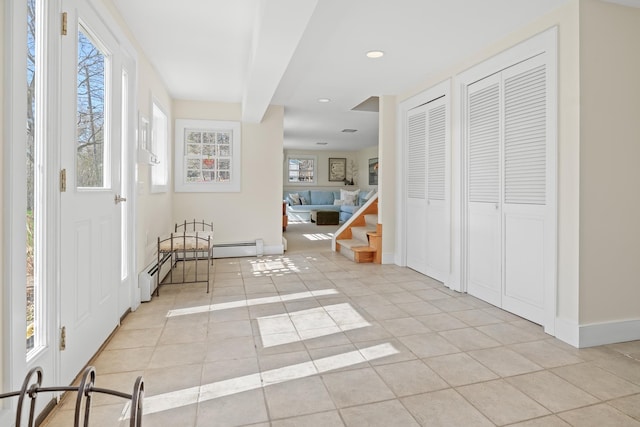 entryway featuring recessed lighting, baseboards, and light tile patterned floors