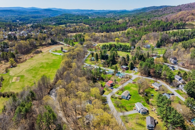 bird's eye view with a wooded view and a mountain view