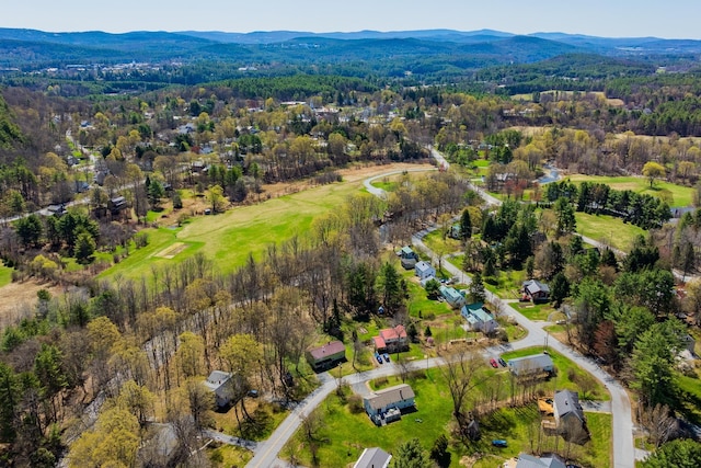 birds eye view of property featuring a mountain view and a forest view