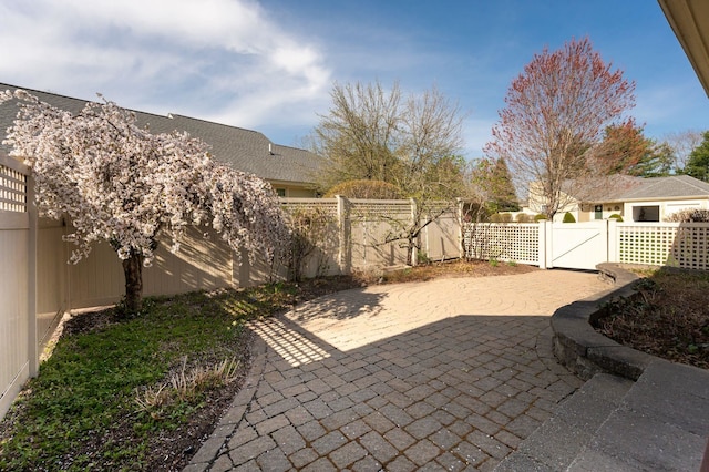 3 Augusta National # 145, Bedford, NH 03110 - view of patio / terrace with a fenced backyard and a gate