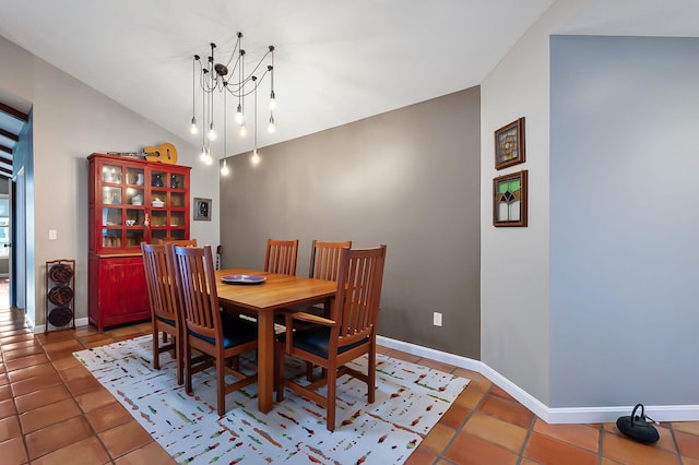 3 Augusta National # 145, Bedford, NH 03110 - dining space featuring an inviting chandelier, tile patterned floors, and baseboards