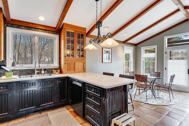 3 Augusta National # 145, Bedford, NH 03110 - kitchen with a breakfast bar area, dishwasher, a sink, dark cabinets, and vaulted ceiling with beams