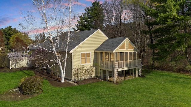 3 Augusta National # 145, Bedford, NH 03110 - rear view of property featuring a sunroom, roof with shingles, and a lawn
