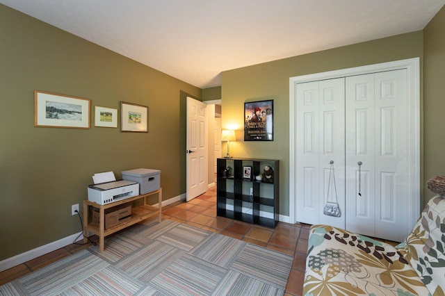 3 Augusta National # 145, Bedford, NH 03110 - bedroom featuring baseboards, tile patterned flooring, and a closet