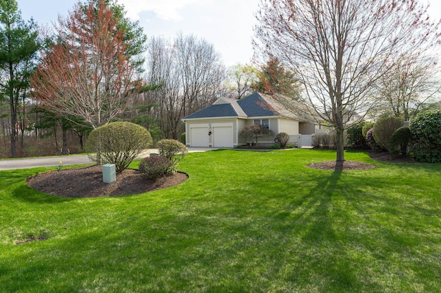 3 Augusta National # 145, Bedford, NH 03110 - view of yard with a garage and driveway
