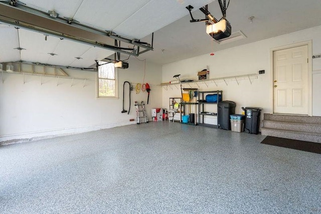 3 Augusta National # 145, Bedford, NH 03110 - garage featuring a garage door opener