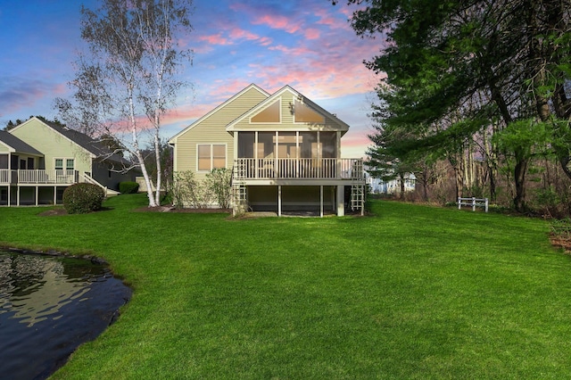 3 Augusta National # 145, Bedford, NH 03110 - back of house at dusk with a lawn and a sunroom