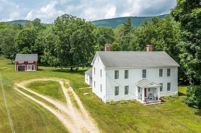 birds eye view of property featuring a wooded view