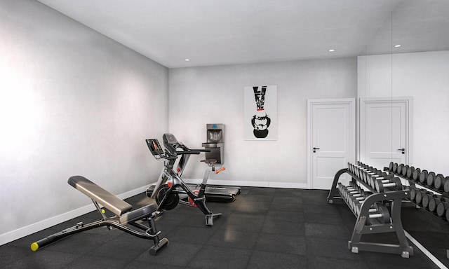 exercise room featuring recessed lighting and baseboards